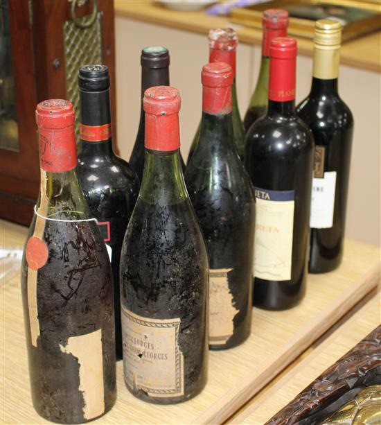 Nine assorted bottles of wine: Burgundy with no label, J. Mommessia to the cap; Badgers Creek Shiraz Cabernet 2007; three Nuits-St-Geor